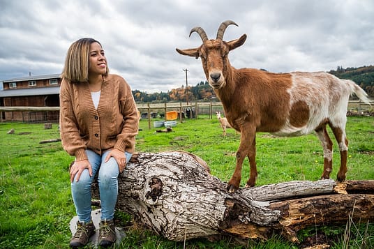 Erin Wing, Deputy Director of Investigations at the animal advocacy NGO Animal Outlook, spends time with Ginger at Wildwood Farm Sanctuary & Preserve. Photo: Jo-Anne McArthur / #unboundproject / We Animals Media