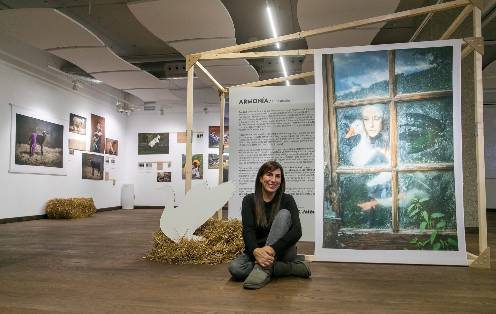 Photojournalist Ana Palacios with her exhibition "Armonia" in Zaragoza, which explores life in animal sanctuaries, spaces dedicated to the protection and care of animals rescued, mostly from the intensive livestock industry. Photo credit: EFE/Javier Cebollada